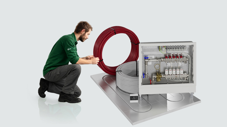 Installer working with underfloor heating
